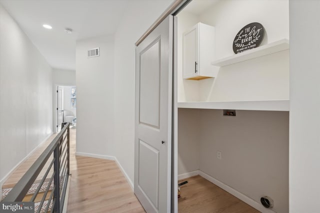 hall with light hardwood / wood-style flooring