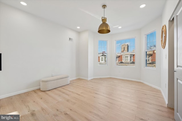 unfurnished room featuring light hardwood / wood-style floors