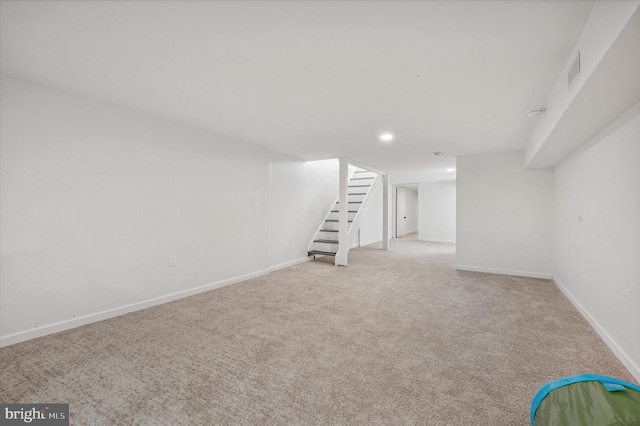 basement with light colored carpet