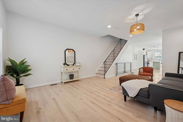 living room with light hardwood / wood-style floors