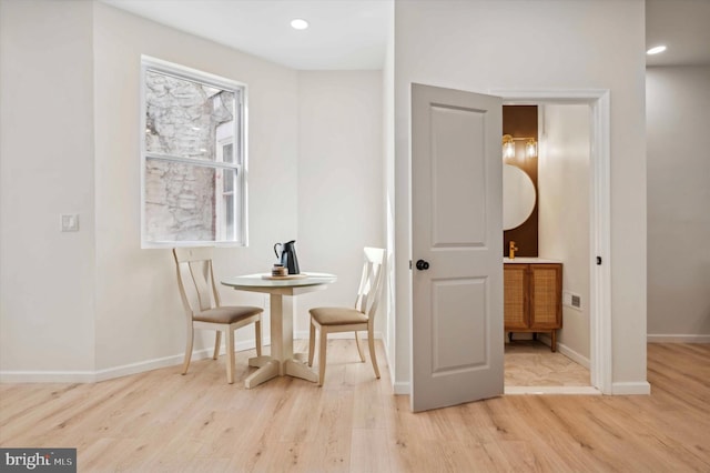 dining area with light hardwood / wood-style floors