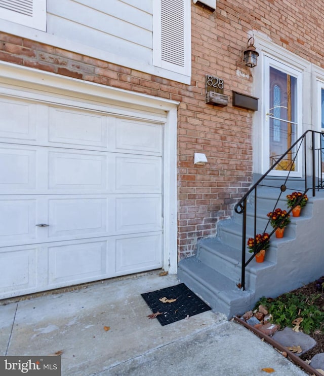 doorway to property featuring a garage