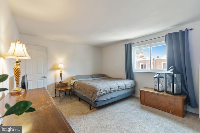 bedroom with light carpet