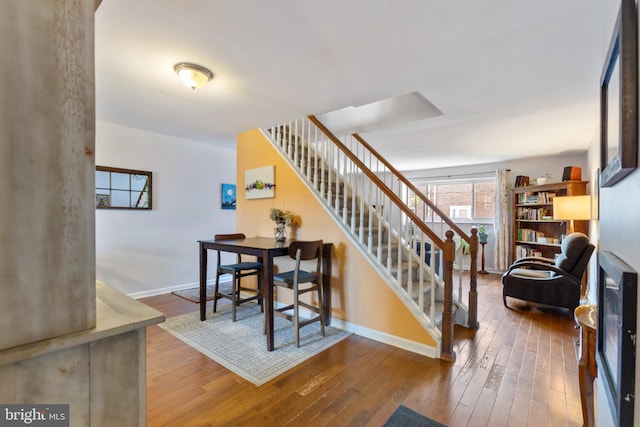 staircase with wood-type flooring