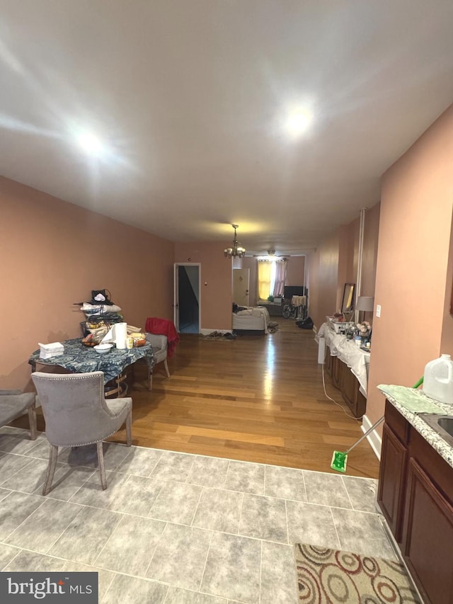 interior space featuring light hardwood / wood-style flooring and a chandelier