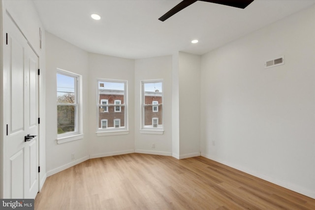 spare room featuring light hardwood / wood-style flooring