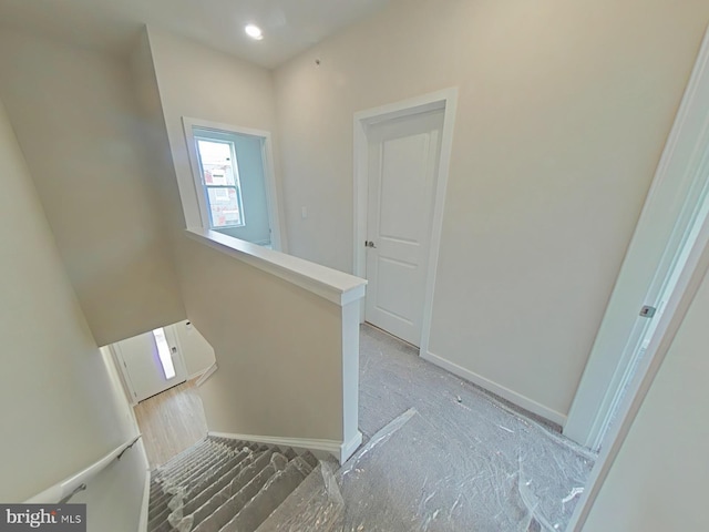 stairway with wood-type flooring