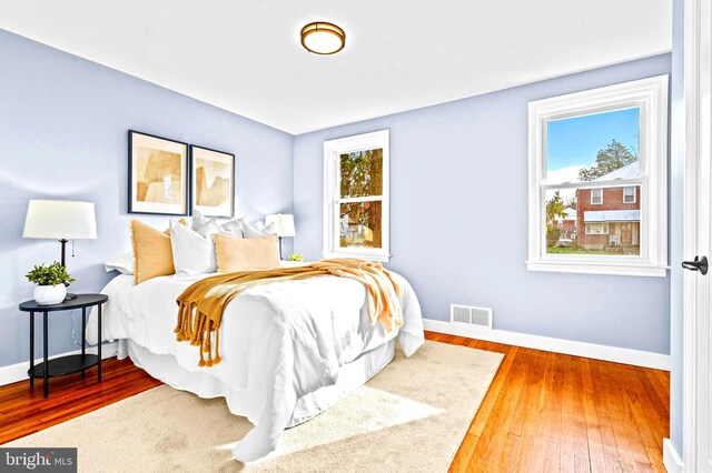 bedroom with wood-type flooring