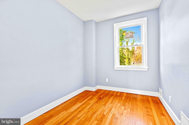 unfurnished room with light hardwood / wood-style floors