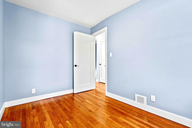 unfurnished room featuring light hardwood / wood-style floors