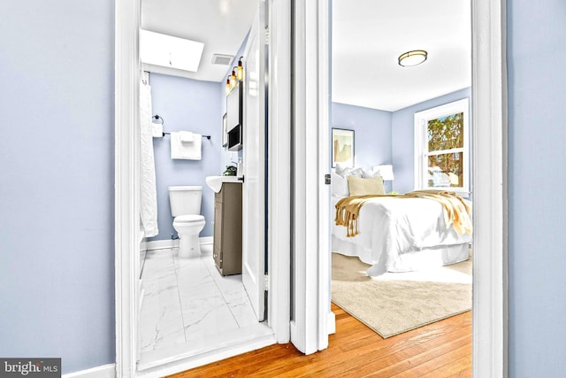 hallway featuring wood-type flooring