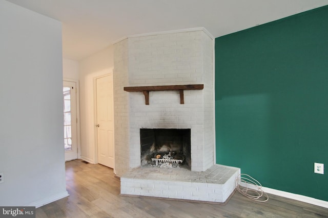 details featuring a fireplace and hardwood / wood-style flooring