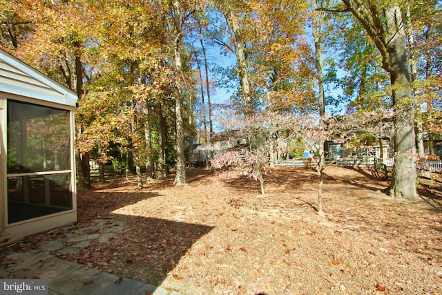 view of yard featuring a sunroom