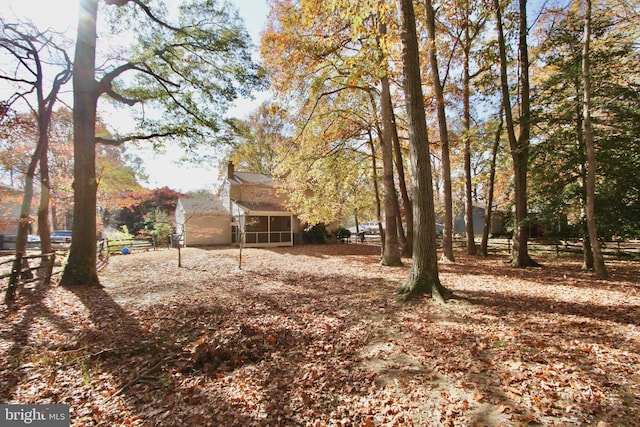 view of yard with a sunroom