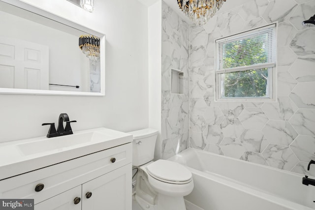 full bathroom featuring vanity, toilet, and tiled shower / bath