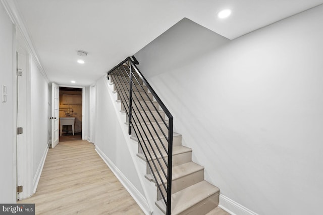 staircase featuring hardwood / wood-style floors