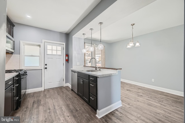 kitchen with stainless steel appliances, plenty of natural light, sink, and decorative backsplash