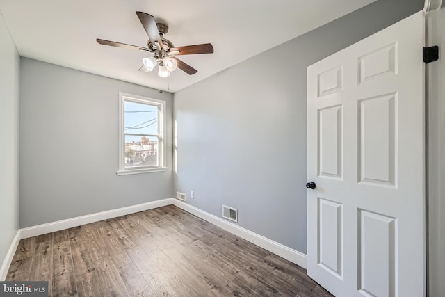 unfurnished room featuring hardwood / wood-style flooring and ceiling fan