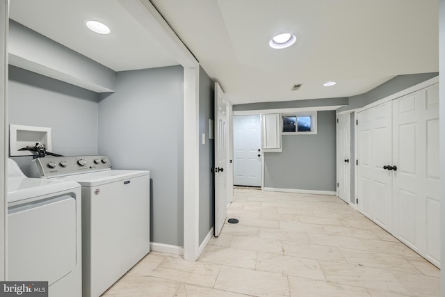 washroom featuring washer and clothes dryer