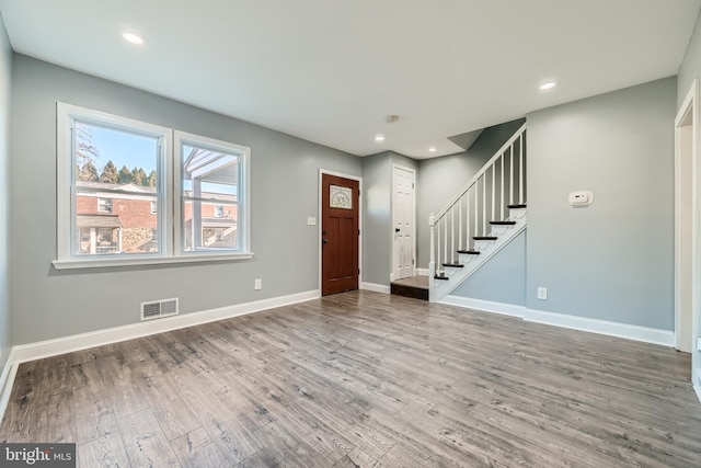 foyer entrance with hardwood / wood-style flooring