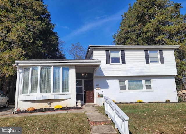 split level home with a front yard