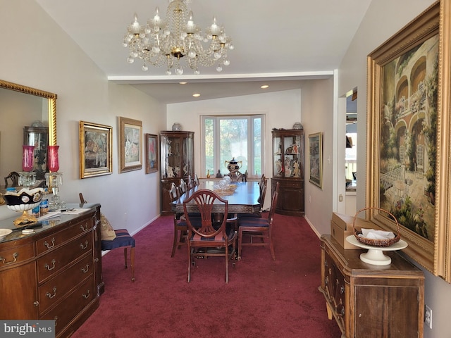 carpeted dining area with a chandelier and vaulted ceiling