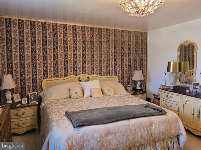 carpeted bedroom with an inviting chandelier