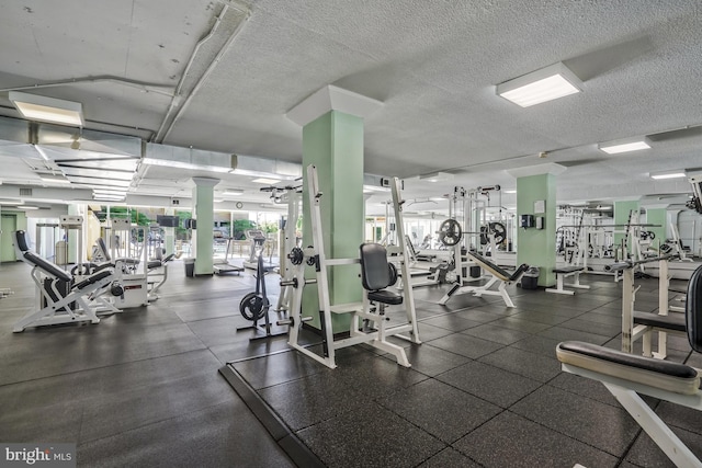 workout area with a textured ceiling