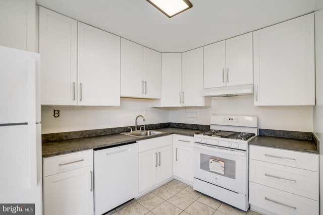 kitchen with white appliances, white cabinetry, and sink