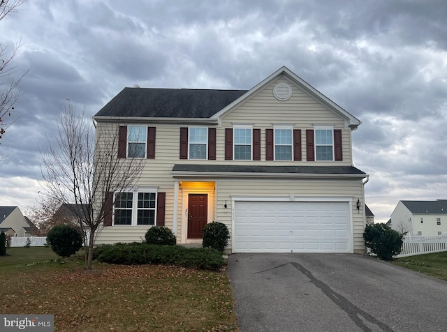 view of front of property with a garage