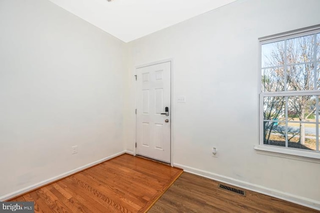 interior space with dark hardwood / wood-style flooring