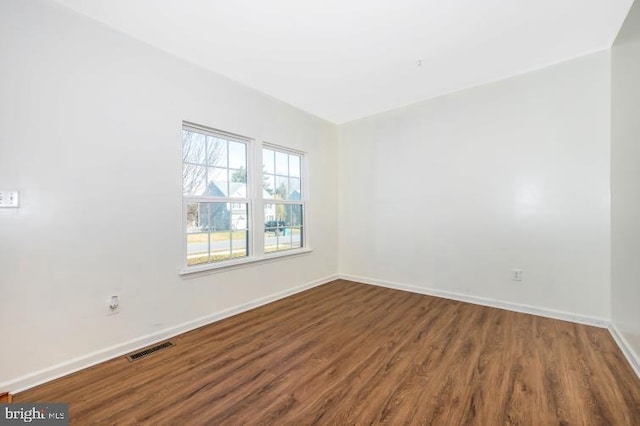 spare room with hardwood / wood-style flooring