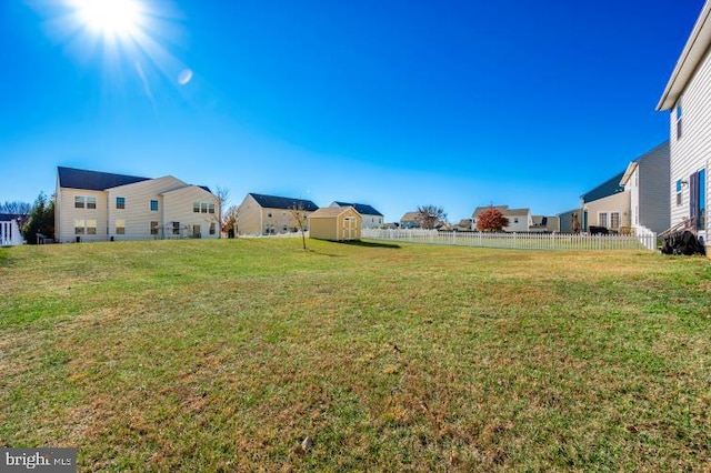 view of yard featuring a storage unit