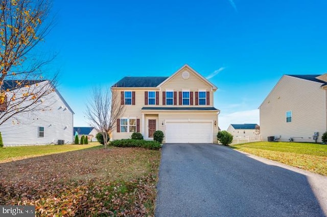 view of front of home with a garage and a front yard