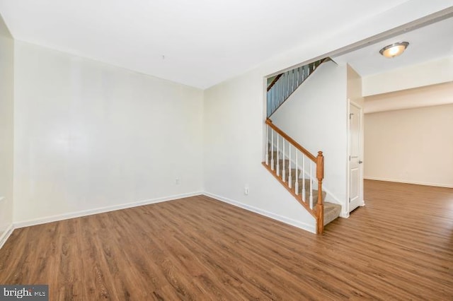 spare room featuring dark hardwood / wood-style floors