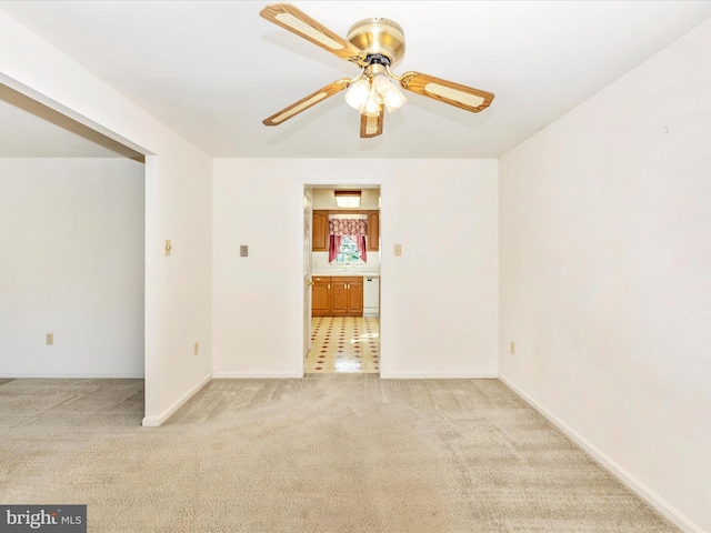 carpeted empty room with ceiling fan