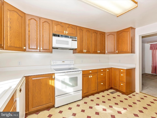 kitchen with sink and white appliances