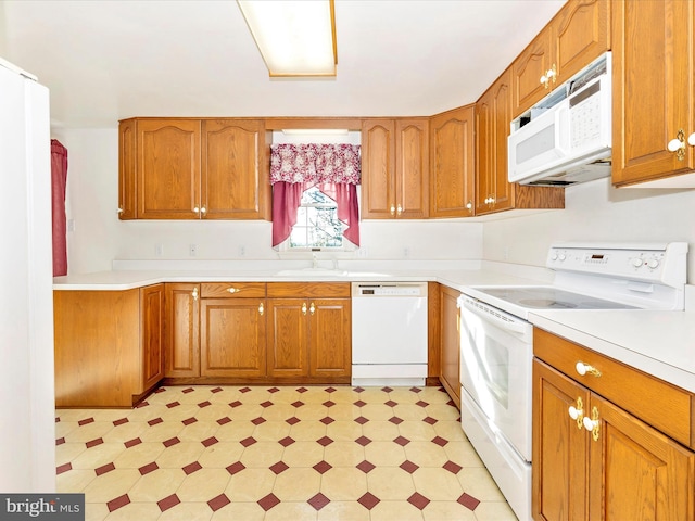 kitchen with sink and white appliances