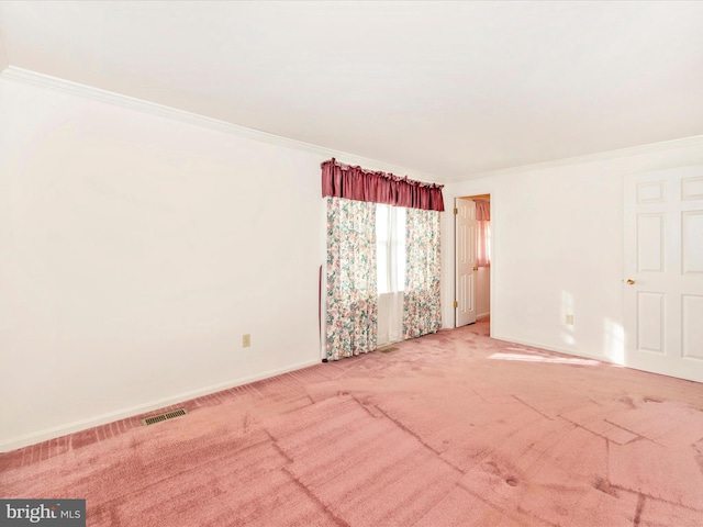 carpeted spare room with ornamental molding