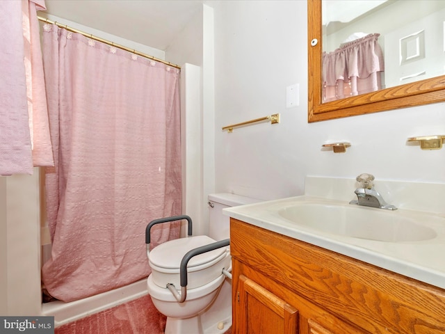 bathroom with vanity, toilet, and curtained shower