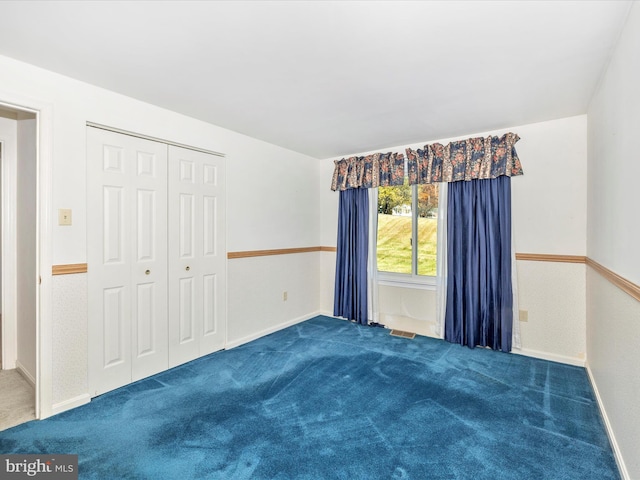 interior space with a closet and carpet flooring