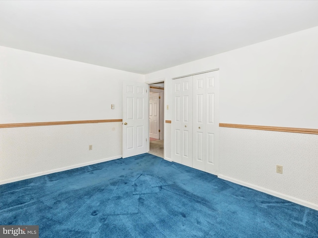 empty room with carpet flooring