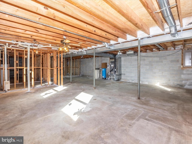 basement with water heater and electric panel