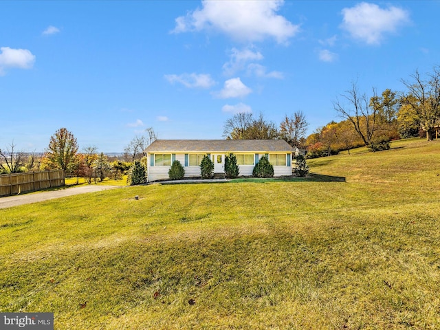 ranch-style house with a front yard