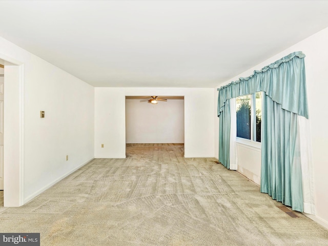 carpeted empty room with ceiling fan