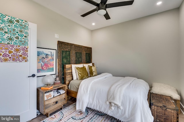 bedroom with hardwood / wood-style flooring and ceiling fan