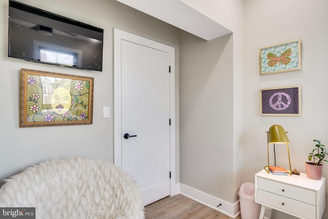 sitting room featuring light hardwood / wood-style flooring