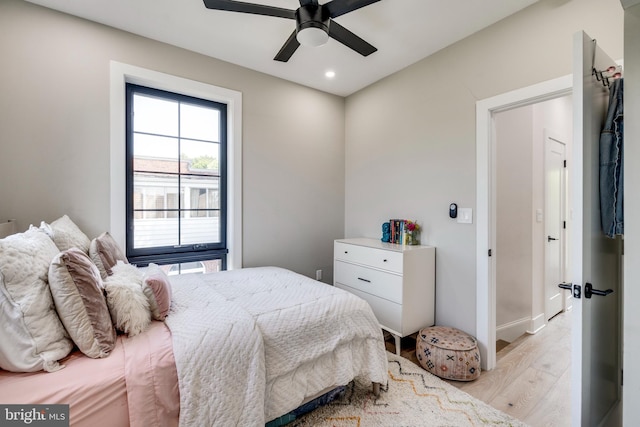 bedroom featuring light hardwood / wood-style floors and ceiling fan