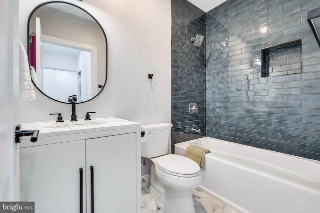 full bathroom featuring vanity, tiled shower / bath, and toilet