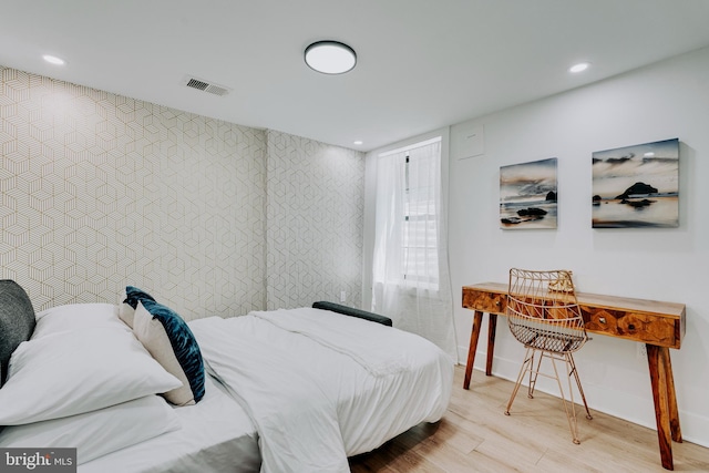 bedroom with light hardwood / wood-style floors